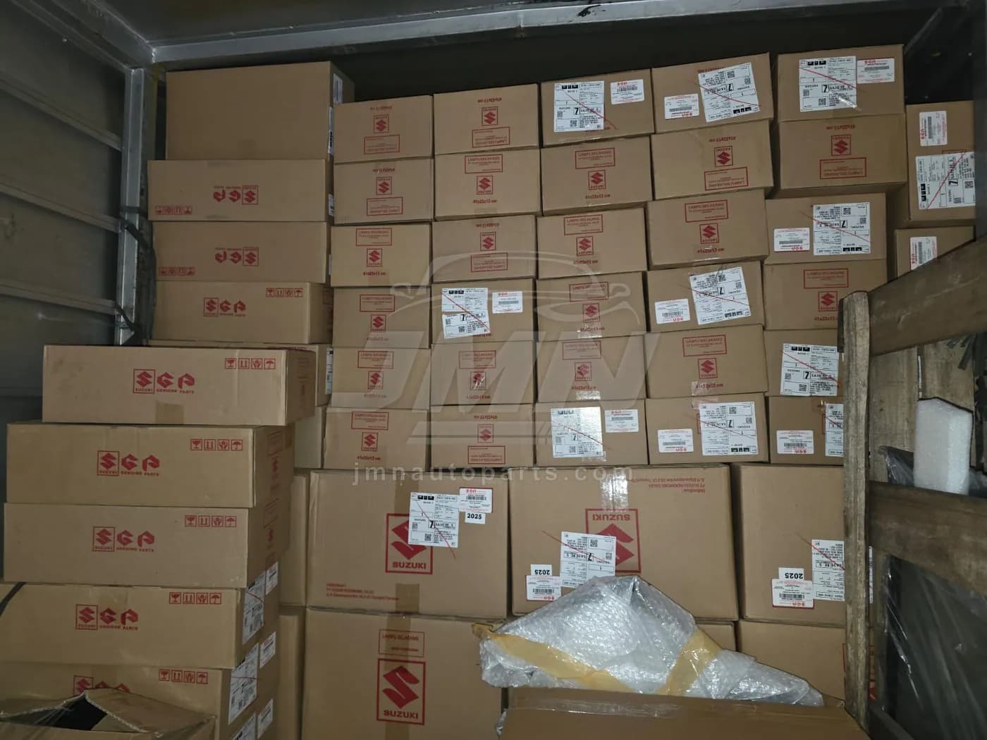 Truck loaded with Suzuki Genuine Parts cartons of tail lamps ready for dispatch
